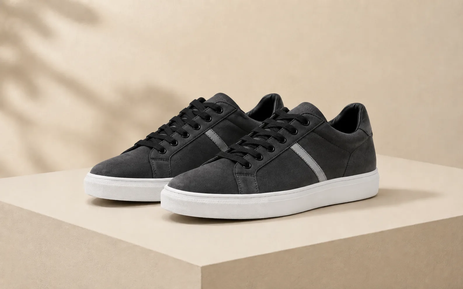 Before-and-after comparison of white sneakers edited into a darker suede style with new detailing. result