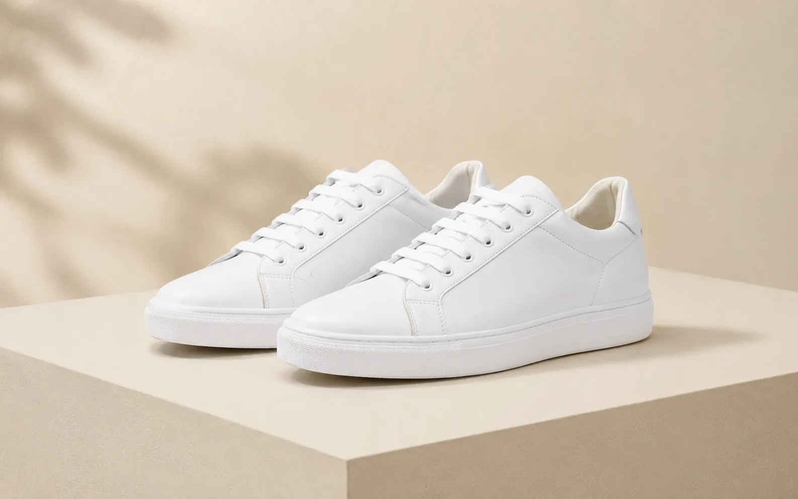 Before-and-after comparison of white sneakers edited into a darker suede style with new detailing.
