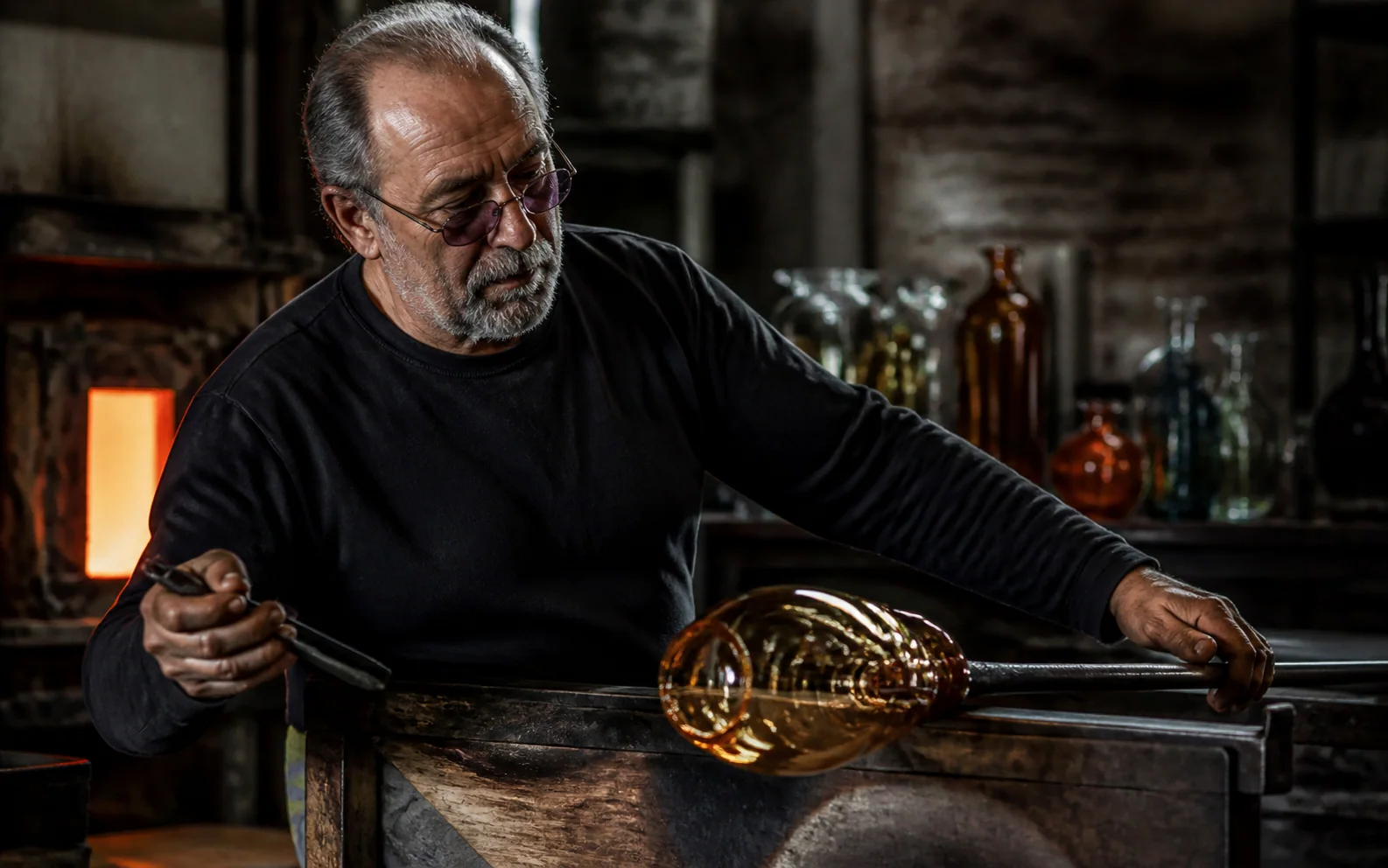 Photorealistic close view of a glassblower shaping glowing amber glass inside a dark workshop.