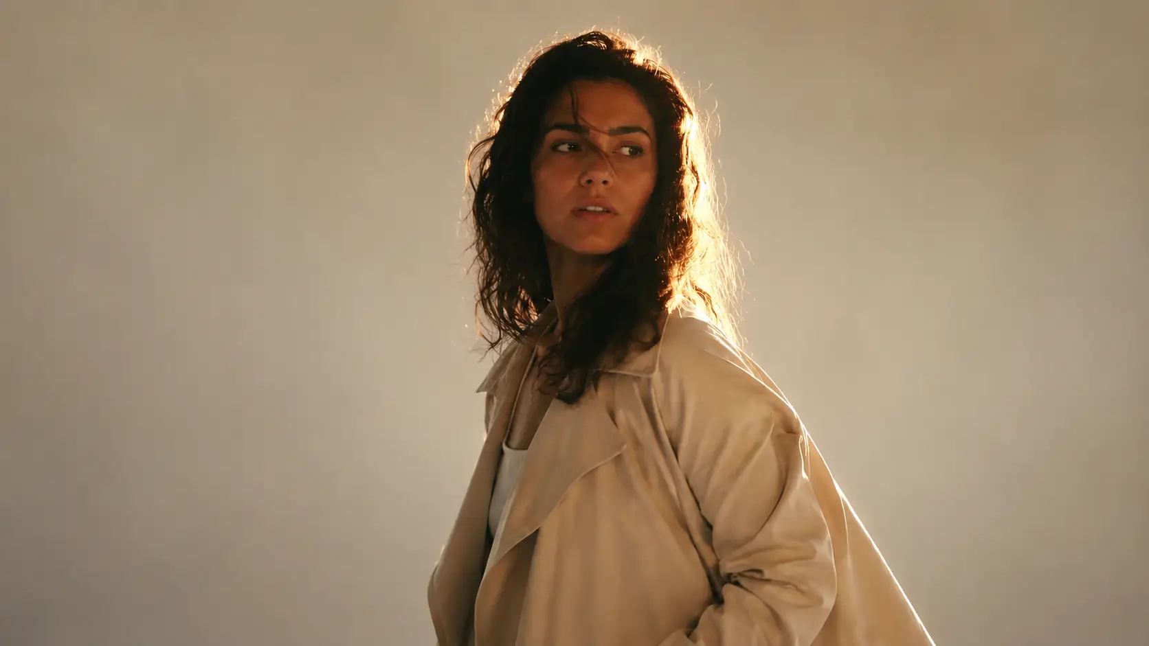 Background removal comparison showing a backlit person with loose hair against a brighter window scene. result