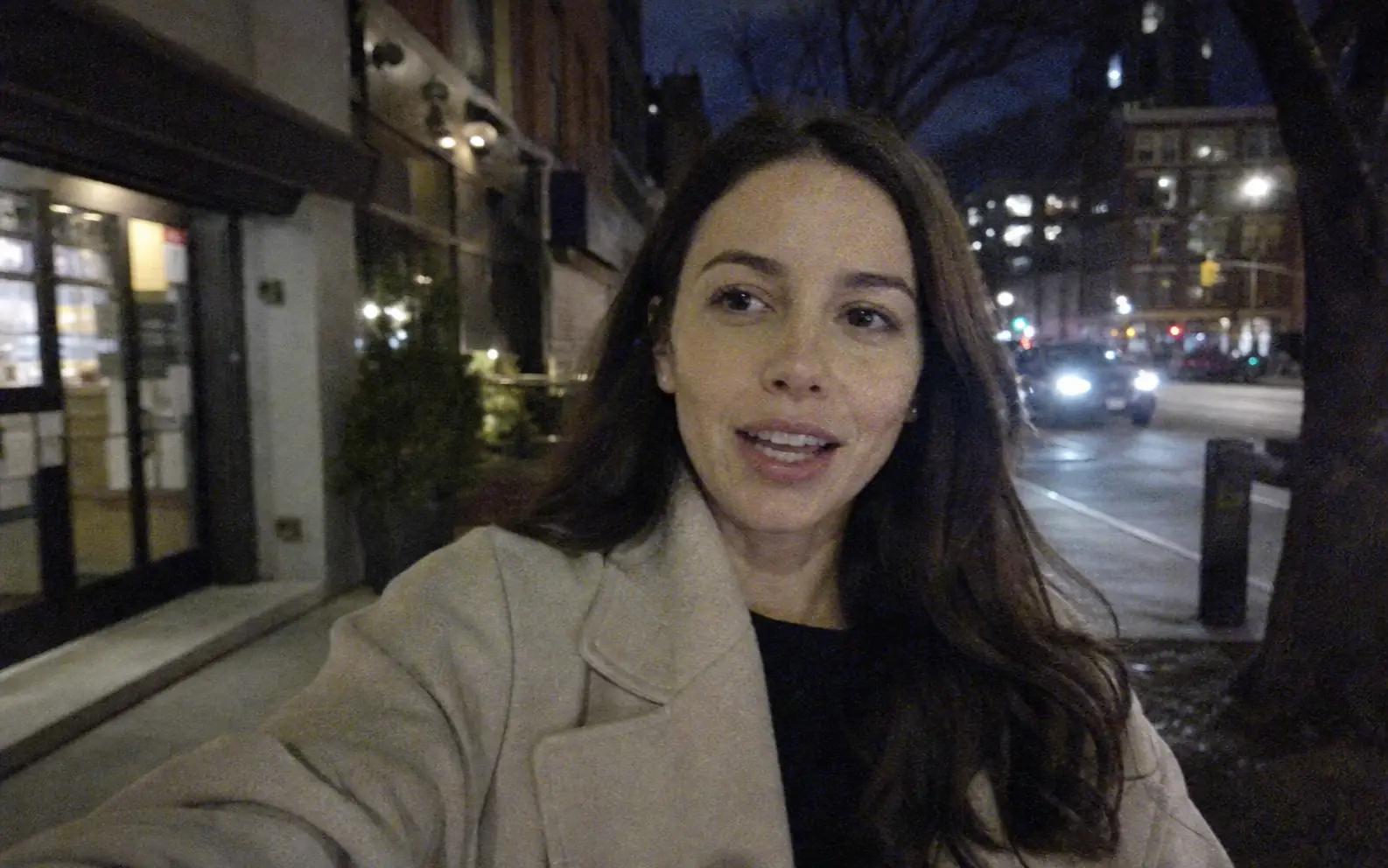 Before-and-after slider for a low-light street clip, showing reduced noise and clearer detail after enhancement.