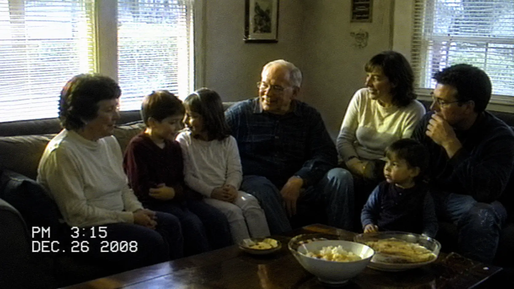 Before-and-after slider for family footage, showing an older low-resolution home video and a larger higher-resolution upscale.